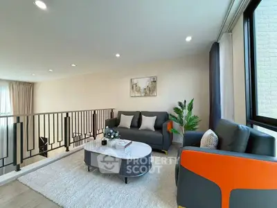 Modern living room with stylish furniture and natural light, perfect for relaxation and entertaining.