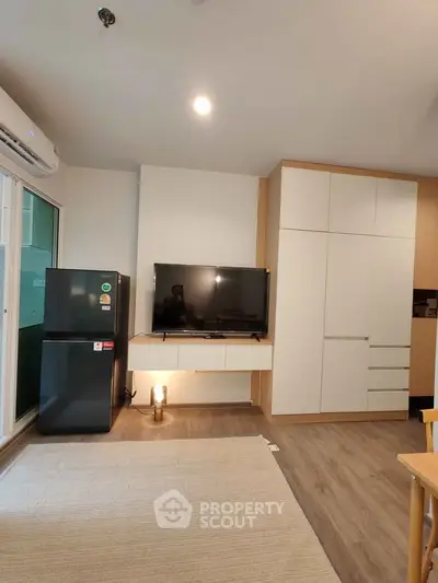 Modern living room with sleek TV setup and stylish storage solutions