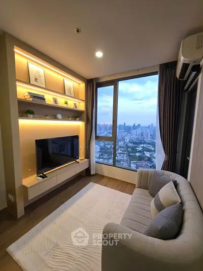 Modern living room with city view, featuring stylish decor and large window for natural light.