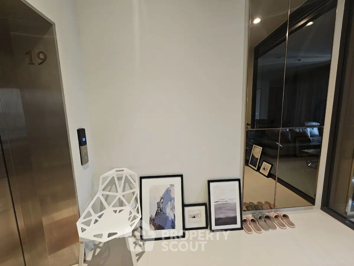 Modern apartment entrance with stylish decor and elevator access