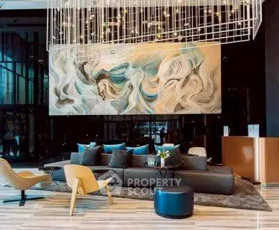 Luxurious modern lobby with artistic decor and stylish seating area.