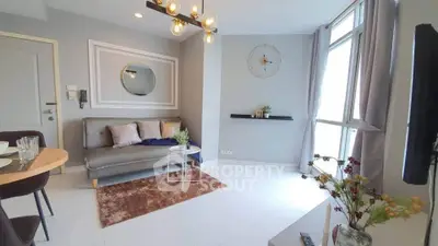 Modern living room with stylish decor and large windows for natural light.