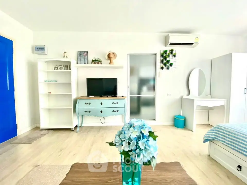 Bright and airy living room with modern decor and blue accents