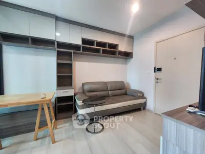 Modern living room with sleek furniture and ample storage space