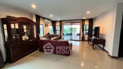 Spacious living room with elegant furniture and large windows for natural light.