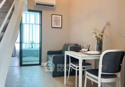 Modern living room with dining area and staircase in stylish apartment