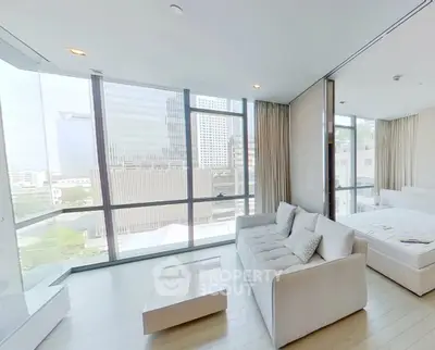 Modern apartment with floor-to-ceiling windows and city view