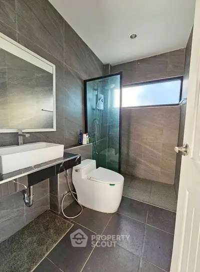 Modern bathroom with sleek design and glass shower enclosure