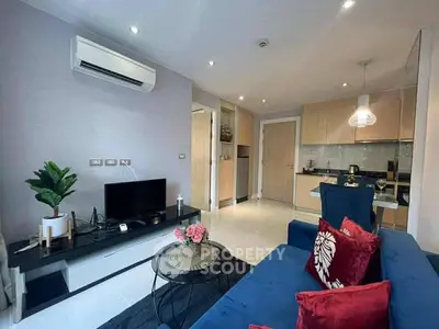 Modern living room with stylish decor and open kitchen layout