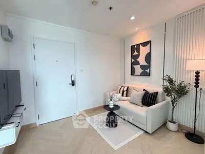 Modern living room with stylish decor and cozy seating area.
