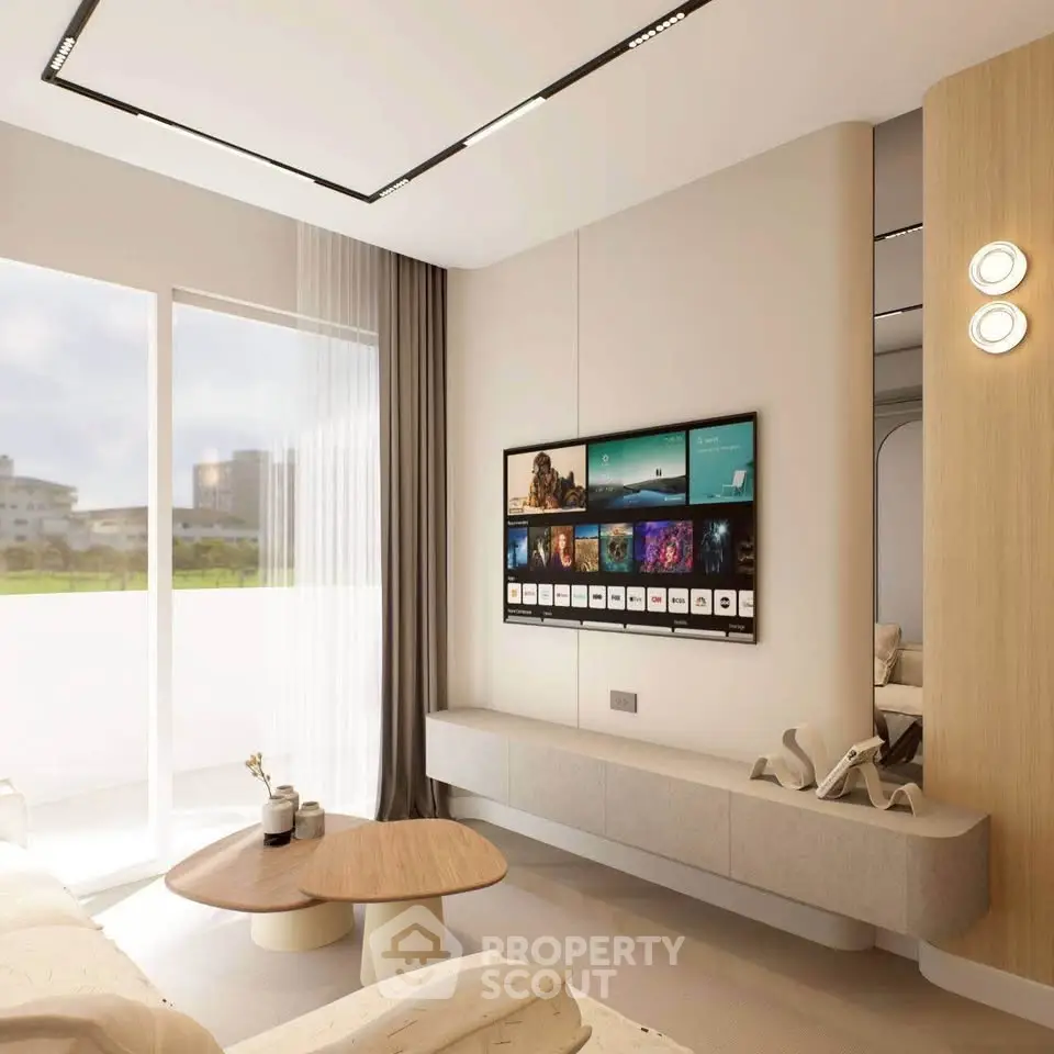 Modern living room with sleek design and large window offering natural light and scenic view.