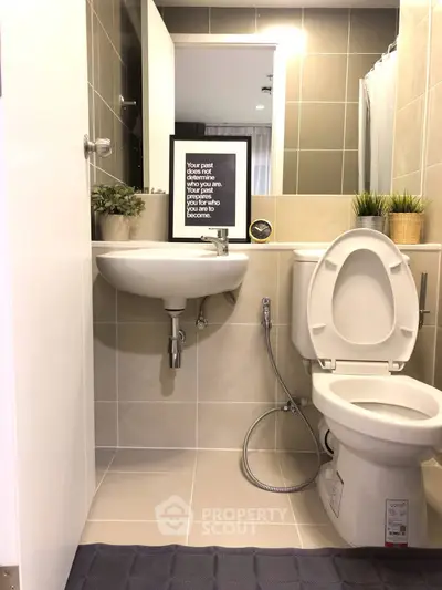 Modern bathroom with stylish decor and functional fixtures in a cozy apartment.