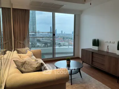 Modern living room with city view, stylish furniture, and large windows in a high-rise apartment.
