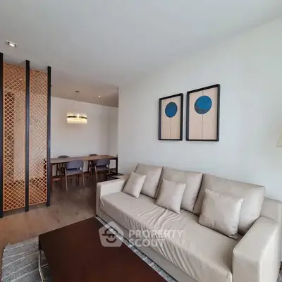 Modern living room with elegant decor and spacious dining area