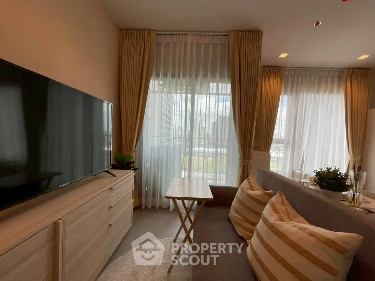 Modern living room with large windows and stylish decor