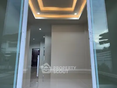 Modern interior with recessed lighting and glossy tile flooring