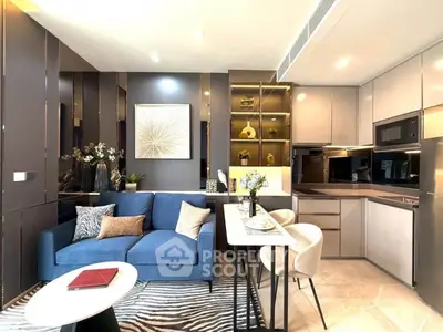 Modern living room with blue sofa and stylish kitchen in open layout apartment