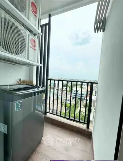 Charming balcony with city view and modern washing machine setup.