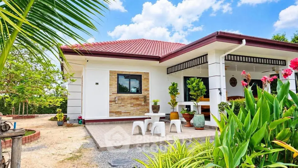 Charming single-story home with lush garden and inviting patio, perfect for tranquil living.