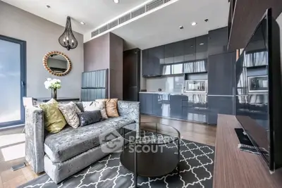 Luxurious modern living room with sleek kitchen, plush sofa, and stylish decor in open-concept apartment.