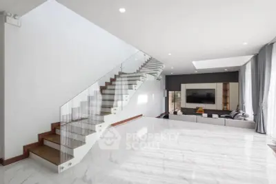 Spacious modern living room with elegant staircase and sleek design