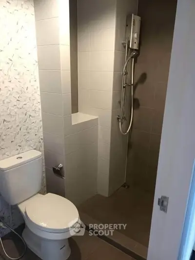 Modern bathroom with shower and toilet in sleek design
