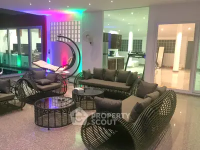 Luxurious modern living room with stylish wicker furniture and ambient lighting