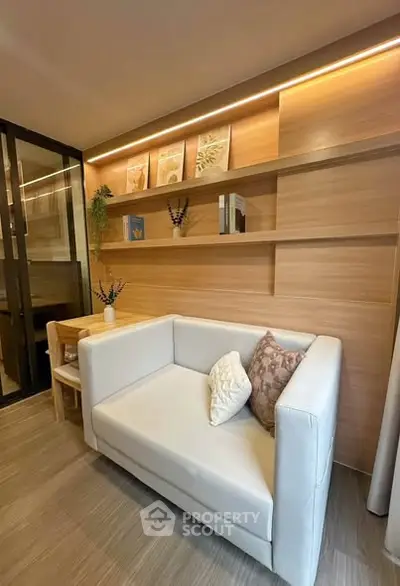 Modern living room with cozy sofa and stylish wooden shelving