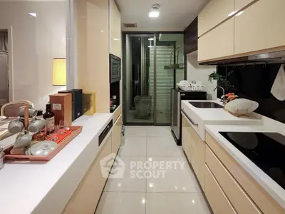 Modern kitchen with sleek cabinetry and open layout, featuring built-in appliances and elegant countertops.