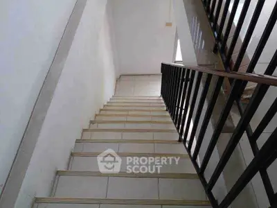 Modern staircase with sleek railing in a contemporary building