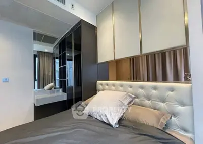 Modern bedroom with stylish decor and ample storage space