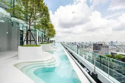 Luxurious rooftop infinity pool with stunning city skyline view
