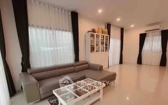 Spacious modern living room with sleek sofa and elegant decor