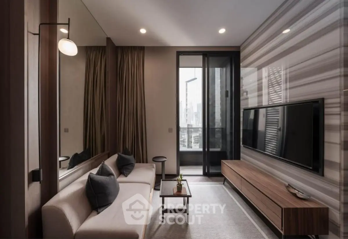 Modern living room with sleek design, featuring a large TV, stylish sofa, and floor-to-ceiling windows.