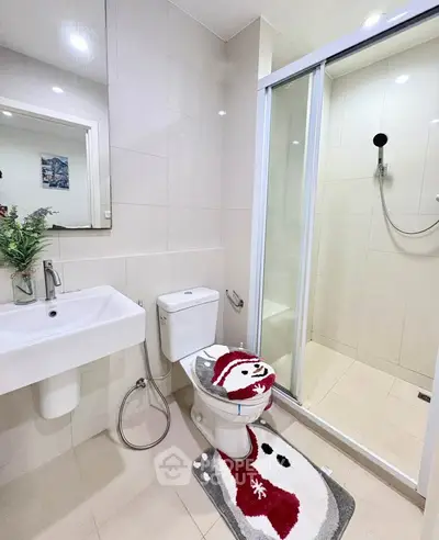 Modern bathroom with shower and stylish decor in a contemporary home.