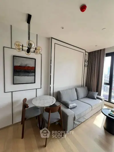 Modern living room with stylish decor, featuring a cozy sofa, elegant dining set, and contemporary artwork.