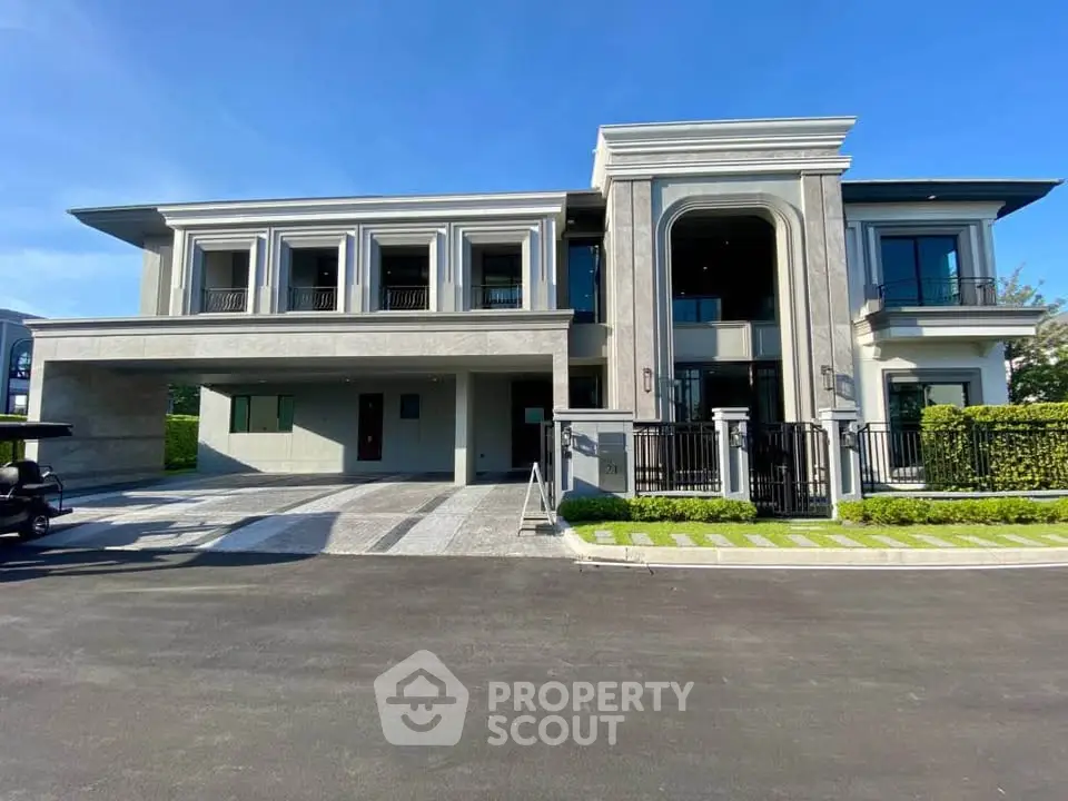 Luxurious modern mansion with grand entrance and spacious driveway