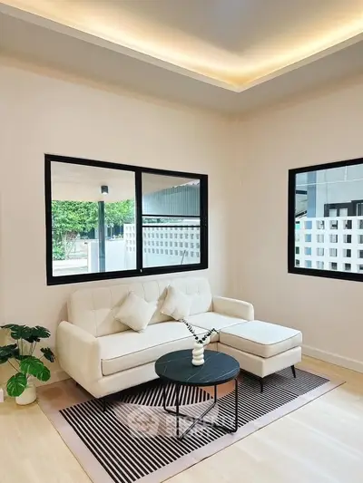 Modern living room with cozy white sofa and stylish decor