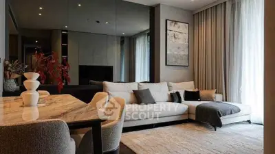 Luxurious modern living room with elegant decor and cozy seating area.