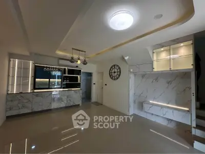 Modern living room with marble accents and stylish lighting