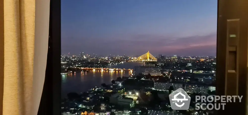 Stunning cityscape view from high-rise apartment window at dusk