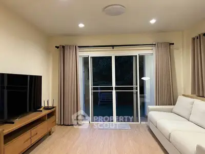 Modern living room with sliding glass doors and cozy furnishings
