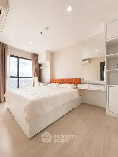 Spacious modern bedroom with city view and elegant furnishings