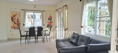 Spacious living room with modern furniture and large windows for natural light.