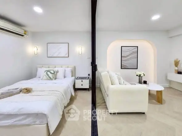 Modern studio apartment with cozy bedroom and stylish living area