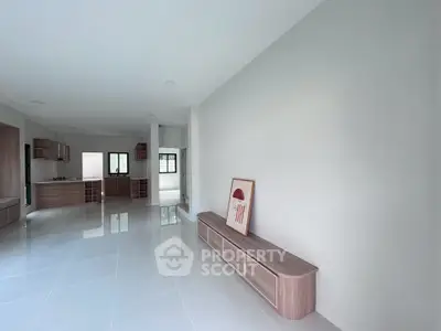 Spacious modern living room with sleek design and ample natural light