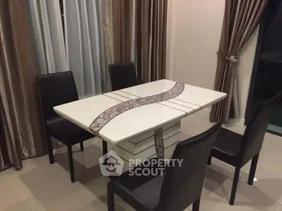 Elegant dining area with modern table and chairs, perfect for stylish gatherings.