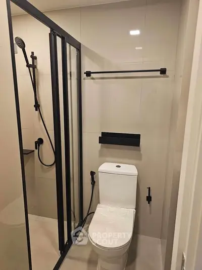 Modern bathroom with sleek shower enclosure and contemporary fixtures