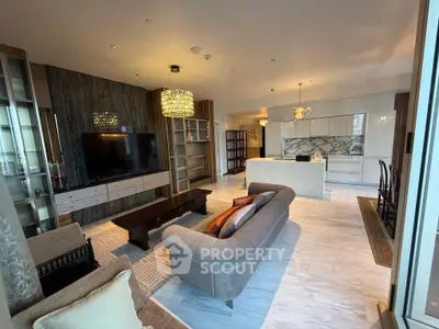 Luxurious open-plan living room with modern kitchen and elegant decor