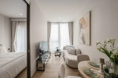 Modern open-plan living room with elegant decor and natural light